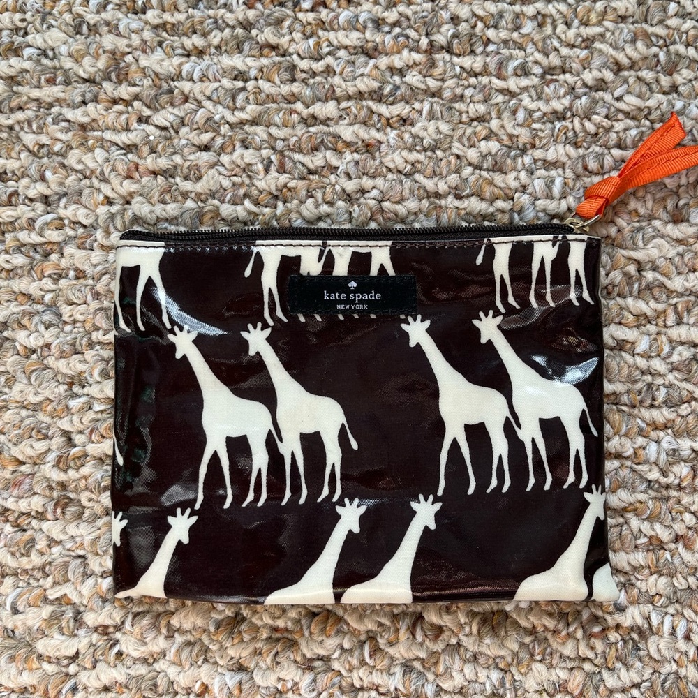 Kate Spade zippered pouch! Giraffe print with vinyl exterior and cloth interior.